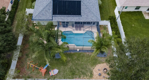 Ocala, FL Real Estate Photography - Aerial View of top of home with pool